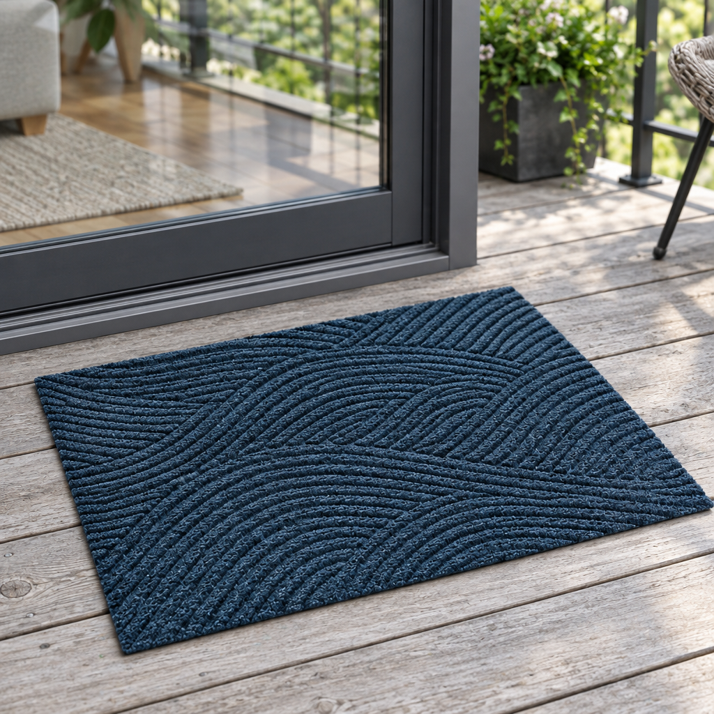 Blue entry door mat beside a balcony door