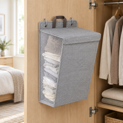 Gray hanging storage basket inside a wardrobe door