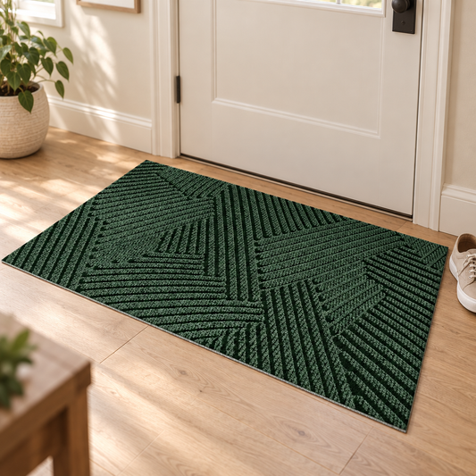 Green geometric entry door mat at a front door